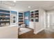 Bright playroom with custom built-in shelves and a cozy window seat at 2880 Emporia Ct, Denver, CO 80238