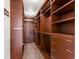 Spacious walk-in closet featuring custom shelving and drawers for organization at 2880 Emporia Ct, Denver, CO 80238