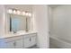 Modern bathroom with a double sink vanity, bright lighting, and modern finishes at 2916 Oxley St, Strasburg, CO 80136