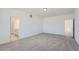 Spacious bedroom with neutral carpeting and white walls, offering a blank canvas for personalization at 2916 Oxley St, Strasburg, CO 80136