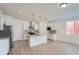 Modern kitchen with a spacious island, granite countertops, and stainless steel appliances at 2916 Oxley St, Strasburg, CO 80136