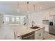Kitchen island with granite countertops, stainless steel dishwasher, and modern pendant lights at 2916 Oxley St, Strasburg, CO 80136