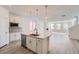 Kitchen island with granite counters and stainless steel appliances in a bright, modern space at 2916 Oxley St, Strasburg, CO 80136
