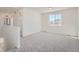 Spacious loft area with neutral carpeting, ideal for a playroom or entertainment space at 2916 Oxley St, Strasburg, CO 80136