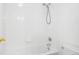 Clean, white bathroom featuring a standard tub and shower at 3815 Red Deer Trl, Broomfield, CO 80020