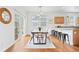 Dining room features a modern table, stylish chairs, and sliding door access to the patio at 3815 Red Deer Trl, Broomfield, CO 80020