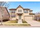 Charming two-story home with a manicured lawn and attached two-car garage at 3815 Red Deer Trl, Broomfield, CO 80020