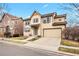 Charming two-story home with a two-car garage, neutral color palette, and well-maintained front lawn at 3815 Red Deer Trl, Broomfield, CO 80020