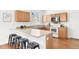 Modern kitchen with a breakfast bar, stainless steel appliances, and ample counter space at 3815 Red Deer Trl, Broomfield, CO 80020