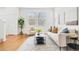 Inviting living room with natural light, neutral colors and modern furniture at 3815 Red Deer Trl, Broomfield, CO 80020