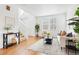 Bright living room features hardwood floors, neutral decor, and plenty of natural light at 3815 Red Deer Trl, Broomfield, CO 80020