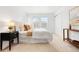 Inviting main bedroom with neutral carpet, closet, window, side table, and decorative pillows at 3815 Red Deer Trl, Broomfield, CO 80020