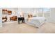 Bright main bedroom with sitting area, neutral carpet, window, side table, and decorative pillows at 3815 Red Deer Trl, Broomfield, CO 80020