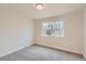 Bright bedroom with large window and neutral carpet; perfect for relaxation and rest at 3673 E Nichols Ave, Centennial, CO 80122