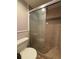 Cozy bathroom features a glass shower with tiled walls and neutral-toned fixtures at 888 N Logan St # 2C, Denver, CO 80203