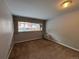 Modest bedroom has carpet floors, neutral walls, and a large window at 888 N Logan St # 2C, Denver, CO 80203