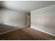Bedroom featuring carpet flooring and a barn door at 888 N Logan St # 2C, Denver, CO 80203