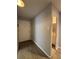 Hallway with a coat closet and a view of the bathroom at 888 N Logan St # 2C, Denver, CO 80203