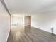 Bright living room featuring modern gray walls and laminate flooring at 888 N Logan St # 2C, Denver, CO 80203