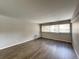 The living room is bright with natural light and wood-look flooring at 888 N Logan St # 2C, Denver, CO 80203