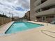 Inviting outdoor pool surrounded by a deck with seating, perfect for relaxation at 888 N Logan St # 2C, Denver, CO 80203