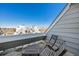 Relaxing balcony featuring outdoor seating with neighborhood views on a sunny day at 17053 E Tennessee Dr # 212, Aurora, CO 80017