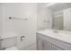 Well-lit bathroom featuring a clean vanity, a large mirror, and a shower-tub combo for your convenience at 17053 E Tennessee Dr # 212, Aurora, CO 80017