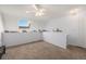 Cozy bedroom featuring soft carpeting, a well-lit ceiling fan, and a bright window providing a great view at 17053 E Tennessee Dr # 212, Aurora, CO 80017