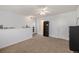 Comfortable bedroom with plush carpeting, a ceiling fan, and a serene view from the window at 17053 E Tennessee Dr # 212, Aurora, CO 80017