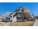 Charming condo with a gray exterior, prominent chimney, and well-maintained lawn on a sunny day at 17053 E Tennessee Dr # 212, Aurora, CO 80017