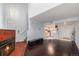 Inviting living room with a warm fireplace, stylish hardwood floors, and an open view of the kitchen at 17053 E Tennessee Dr # 212, Aurora, CO 80017