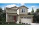 Charming two-story home featuring stone accents, a covered porch, and a two-car garage at 686 N Clubview St, Watkins, CO 80137