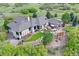 Expansive aerial of a home featuring an outdoor living area, lush backyard, and scenic countryside at 580 Summer Mist Cir, Castle Rock, CO 80104