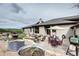 Exterior view showcasing a stone patio and a house with beautiful landscaping at 580 Summer Mist Cir, Castle Rock, CO 80104
