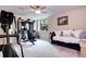 Spacious basement area with exercise equipment and a daybed at 580 Summer Mist Cir, Castle Rock, CO 80104