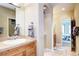 Bathroom featuring a wood vanity and views to the bedroom at 580 Summer Mist Cir, Castle Rock, CO 80104