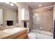 Updated bathroom with glass shower door and decorative tile surround at 580 Summer Mist Cir, Castle Rock, CO 80104