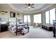 Bright bedroom with tray ceilings and sitting area at 580 Summer Mist Cir, Castle Rock, CO 80104