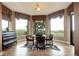 Charming dining area featuring hardwood floors, picturesque views, and comfortable seating for four at 580 Summer Mist Cir, Castle Rock, CO 80104