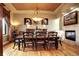 Elegant dining room with a fireplace and decorative lighting at 580 Summer Mist Cir, Castle Rock, CO 80104