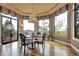Dining room featuring many windows with beautiful outdoor views and a decorative light fixture at 580 Summer Mist Cir, Castle Rock, CO 80104