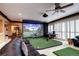Entertainment room featuring golf simulator and comfortable seating at 580 Summer Mist Cir, Castle Rock, CO 80104