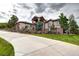 Striking home with stone detailing, well-manicured lawn, and an inviting entrance at 580 Summer Mist Cir, Castle Rock, CO 80104