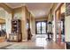 Open-concept foyer with tile floors and ample natural light at 580 Summer Mist Cir, Castle Rock, CO 80104
