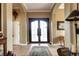 Welcoming foyer with arched doorways and tile flooring at 580 Summer Mist Cir, Castle Rock, CO 80104