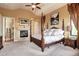 Spacious main bedroom with a fireplace, king bed, and elegant decor at 580 Summer Mist Cir, Castle Rock, CO 80104