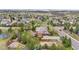 Aerial view of a brick home featuring a playground, volleyball court, and spacious backyard at 286 Claymoor Ct, Castle Pines, CO 80108