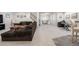 Spacious basement with a lounging area, ping pong table, work station, and neutral colored walls at 286 Claymoor Ct, Castle Pines, CO 80108