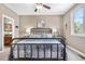 Charming bedroom featuring a metal frame bed, side tables with lamps, and ensuite access at 286 Claymoor Ct, Castle Pines, CO 80108