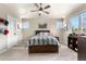 Bedroom with a baseball theme, featuring a wooden bed frame, baseball decor, and built-in shelving at 286 Claymoor Ct, Castle Pines, CO 80108